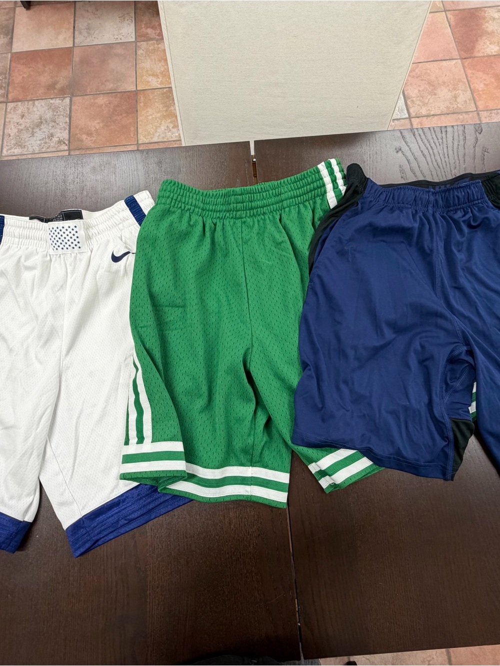 Three pairs of size medium basketball shorts